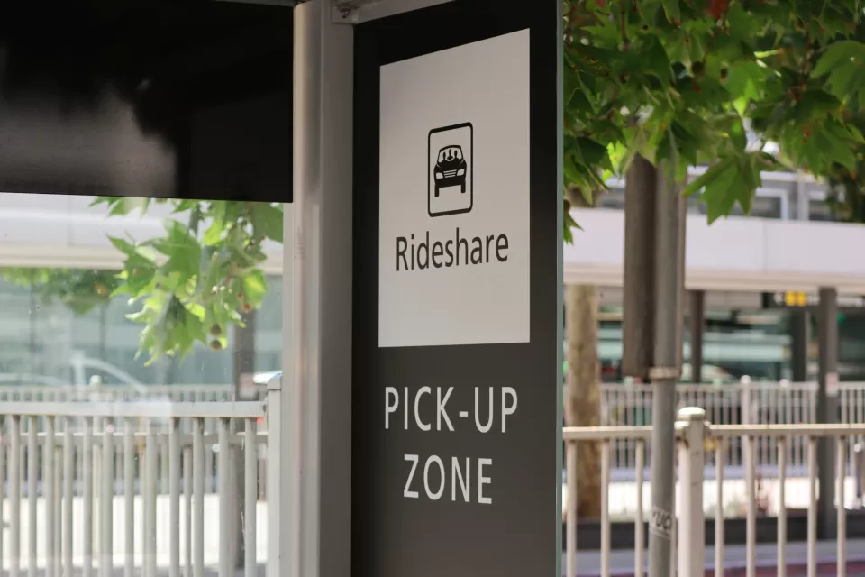 Black and white Rideshare Pick-Up Zone sign